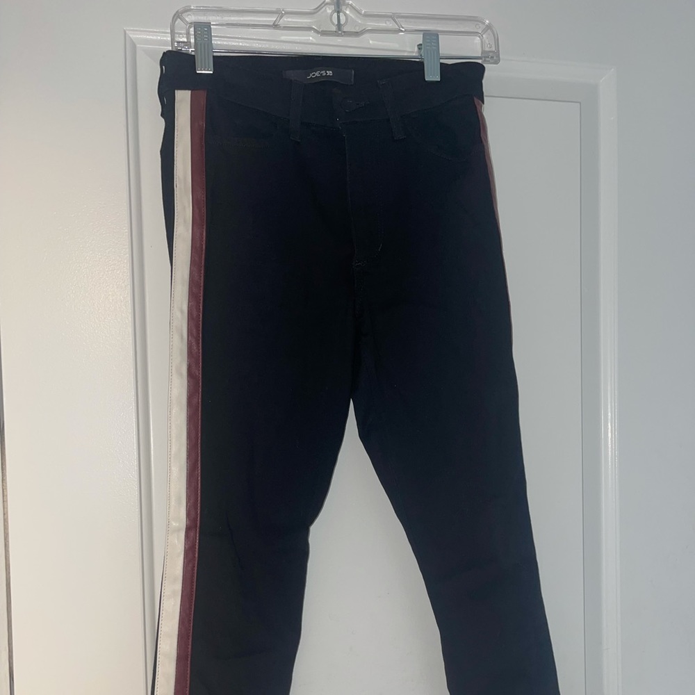 Joe’s black jeans with red and white leather detail on the side